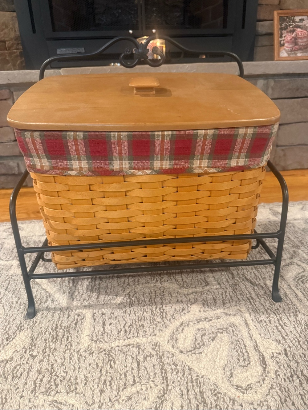 Longaberger newspaper basket. With lid , liner and wrought iron stand
